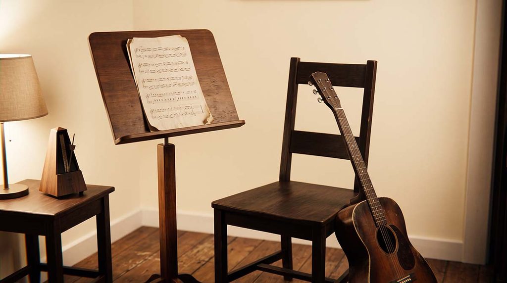 Empty guitar practice chair beside an exercise sheet and metronome, illustrating a fading desire to practice